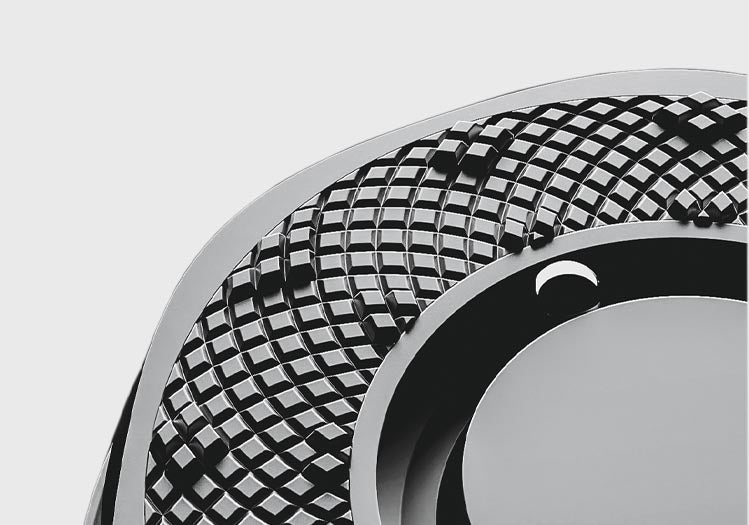 The Sunflower ring seem up close, mostly cropped out and focusing on the diamond like pattern of the ring. The hour markers have been disguised within the diamond pattern, but have been raised and polished to maintain a visual and tactile difference.