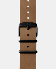 A photo shows the strap lying on a flat surface. One part has a buckle and the other part has a series of holes for an adjustable fit.