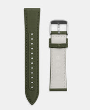 A photo shows the strap lying on a flat surface. One part has a buckle and the other part has a series of holes for an adjustable fit.