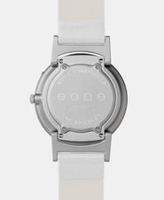 A photo of the back of the watch, showing the back plate engraved with the Eone logo.
