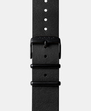 A photo shows the strap lying on a flat surface. One part has a buckle and the other part has a series of holes for an adjustable fit.