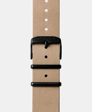 A photo shows the strap lying on a flat surface. One part has a buckle and the other part has a series of holes for an adjustable fit.
