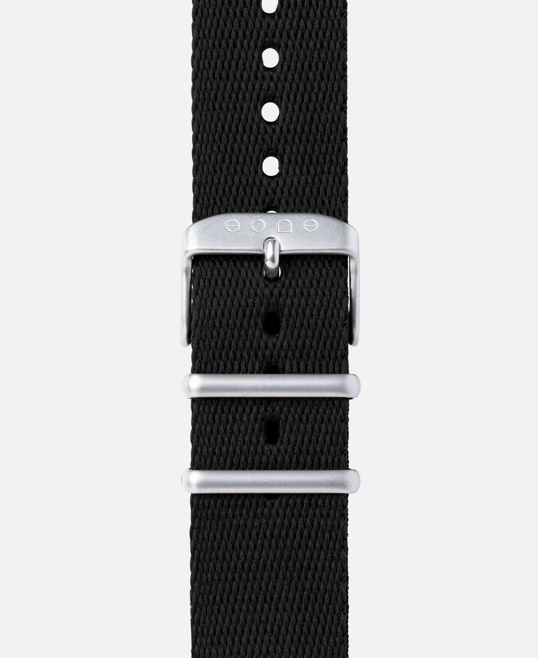 Load image into Gallery viewer, A photo shows the strap lying on a flat surface. One part has a buckle and the other part has a series of holes for an adjustable fit.