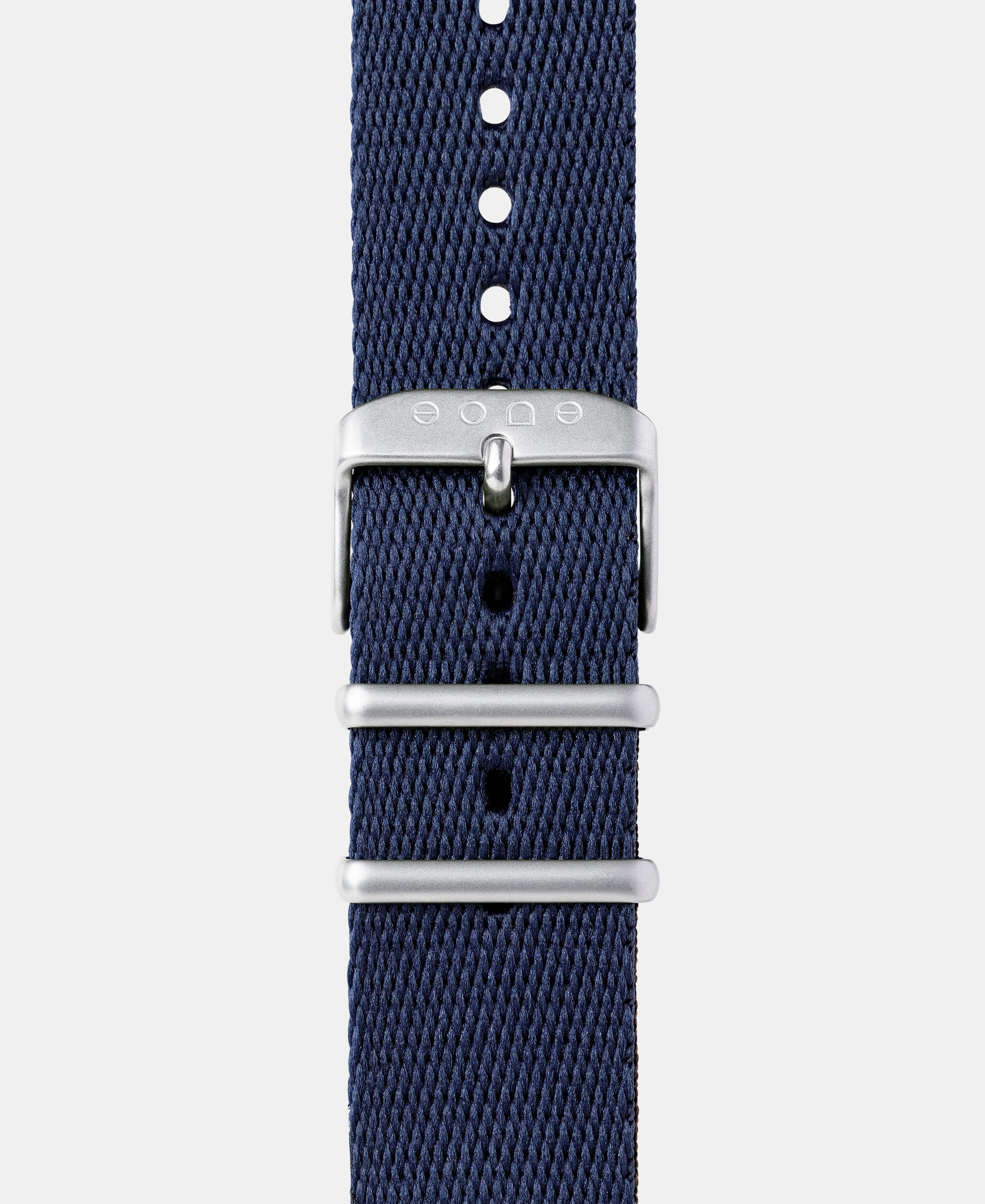 Load image into Gallery viewer, A photo shows the strap lying on a flat surface. One part has a buckle and the other part has a series of holes for an adjustable fit.