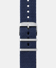 A photo shows the strap lying on a flat surface. One part has a buckle and the other part has a series of holes for an adjustable fit.