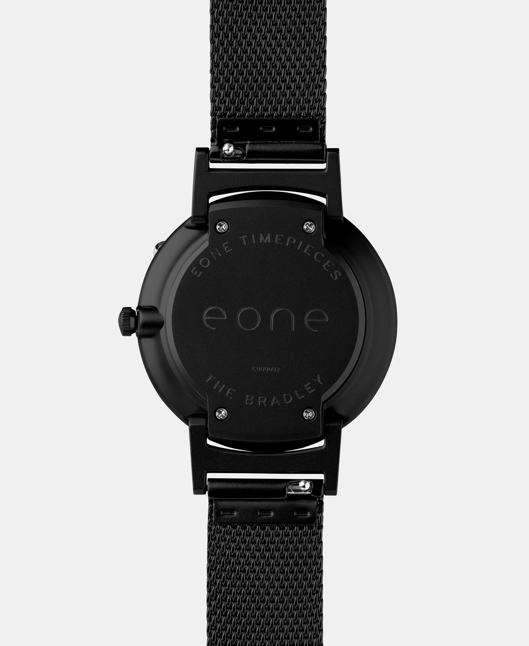 Load image into Gallery viewer, A photo of the back of the watch, showing the back plate engraved with the Eone logo.