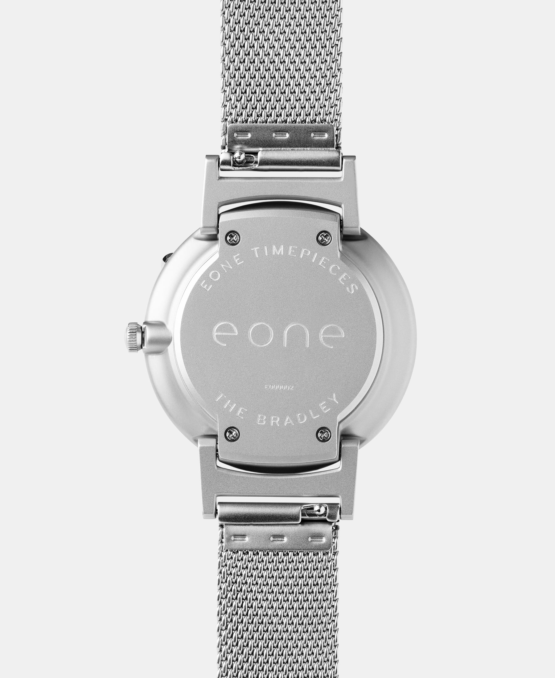 Load image into Gallery viewer, A photo of the back of the watch, showing the back plate engraved with the Eone logo.