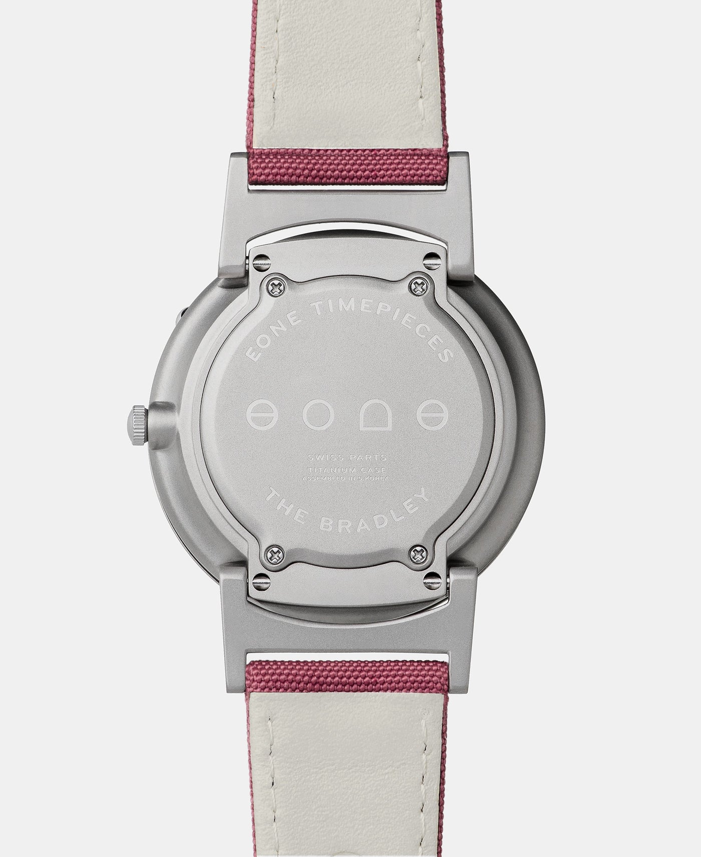 A photo of the back of the watch, showing the back plate engraved with the Eone logo.