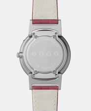 A photo of the back of the watch, showing the back plate engraved with the Eone logo.