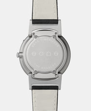 A photo of the back of the watch, showing the back plate engraved with the Eone logo.