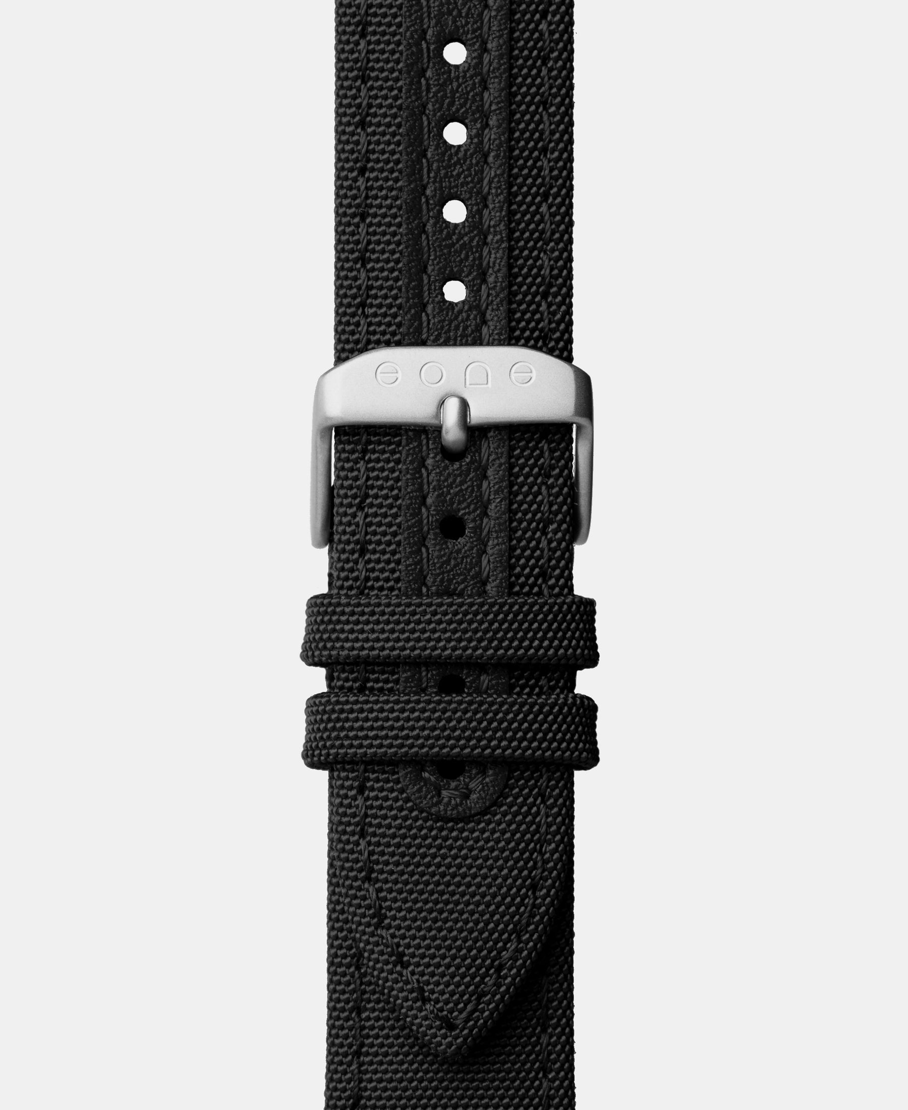 Load image into Gallery viewer, A photo shows the strap lying on a flat surface. One part has a buckle and the other part has a series of holes for an adjustable fit.