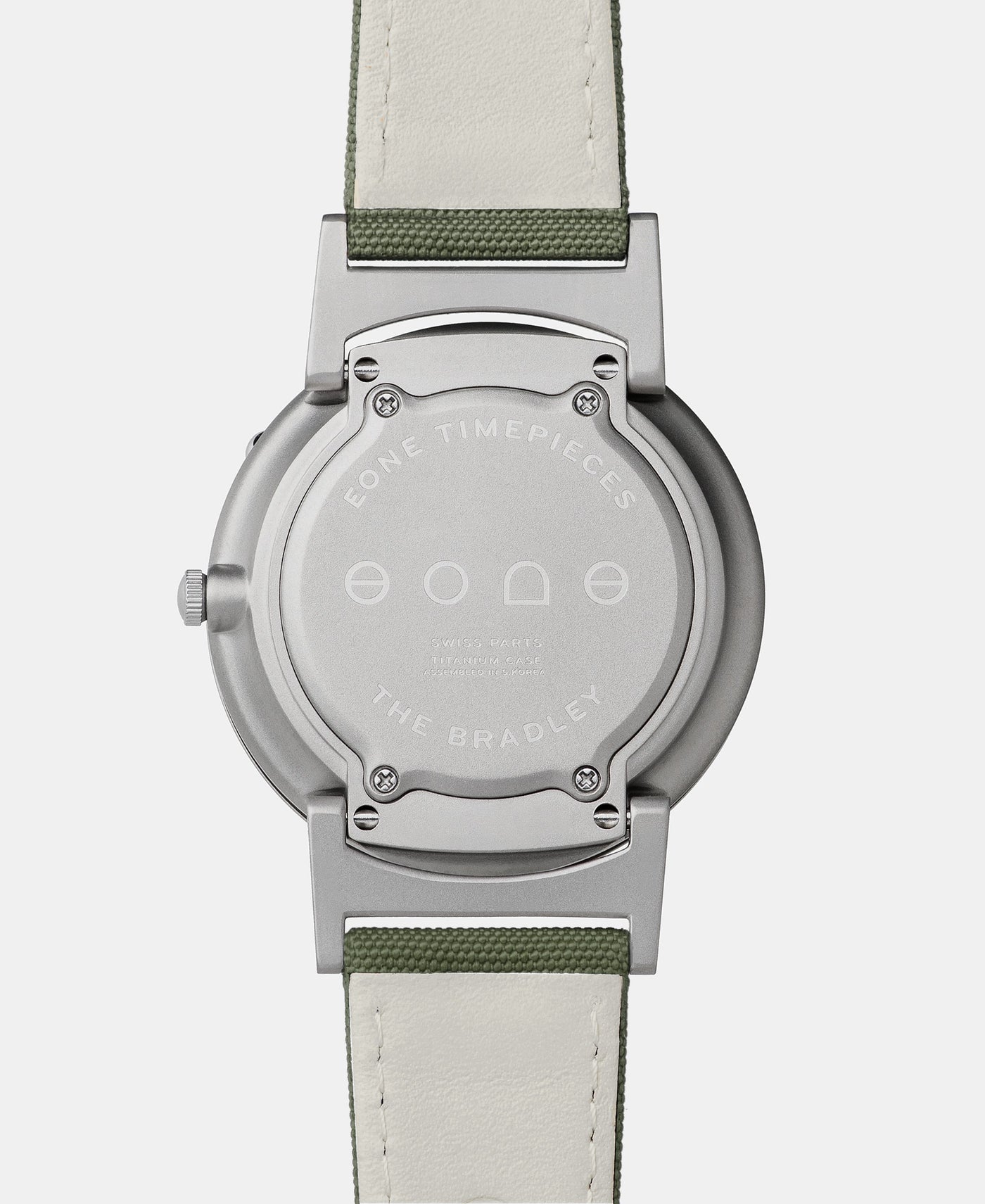 A photo of the back of the watch, showing the back plate engraved with the Eone logo.
