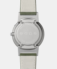 A photo of the back of the watch, showing the back plate engraved with the Eone logo.