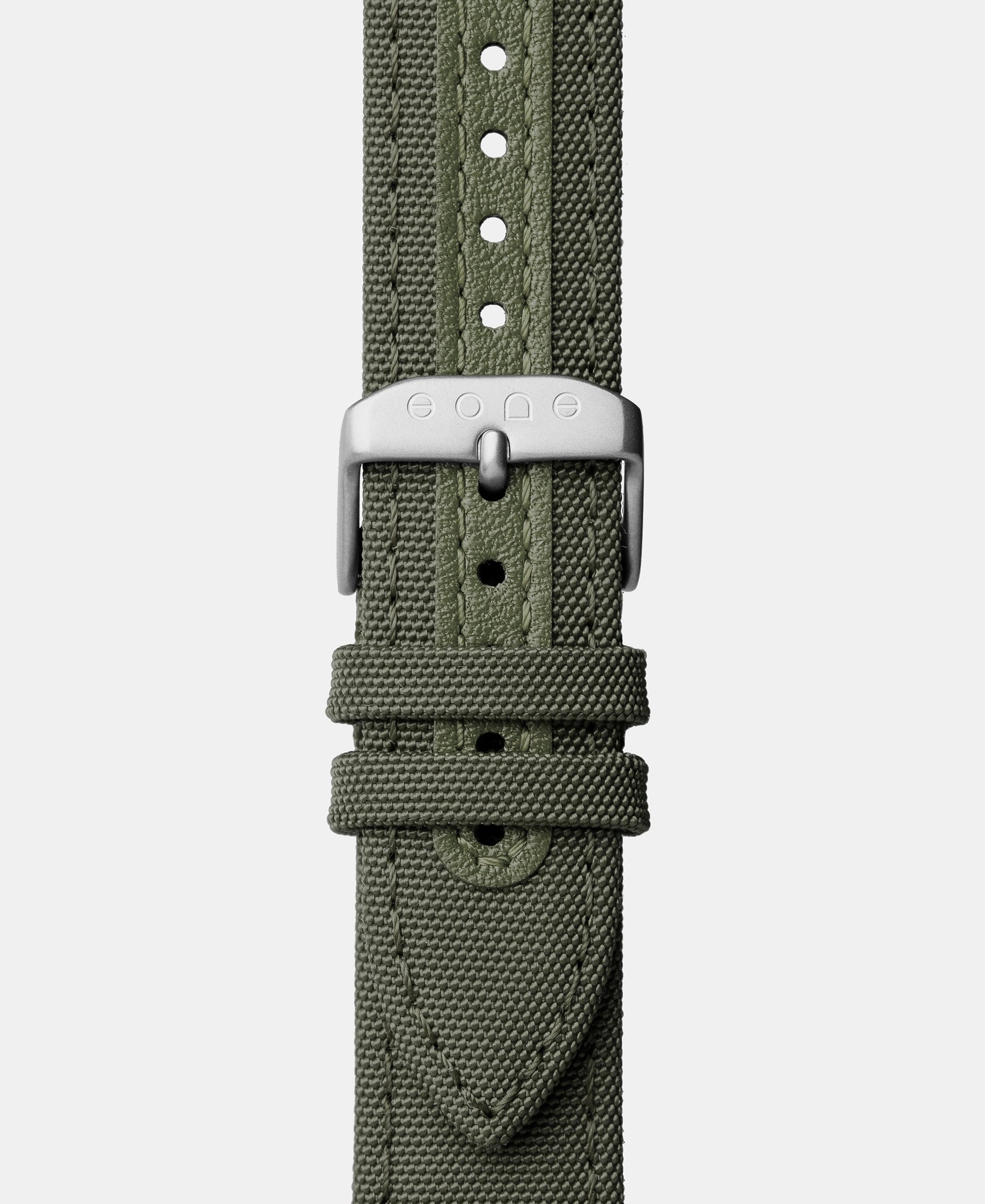 Load image into Gallery viewer, A photo shows the strap lying on a flat surface. One part has a buckle and the other part has a series of holes for an adjustable fit.