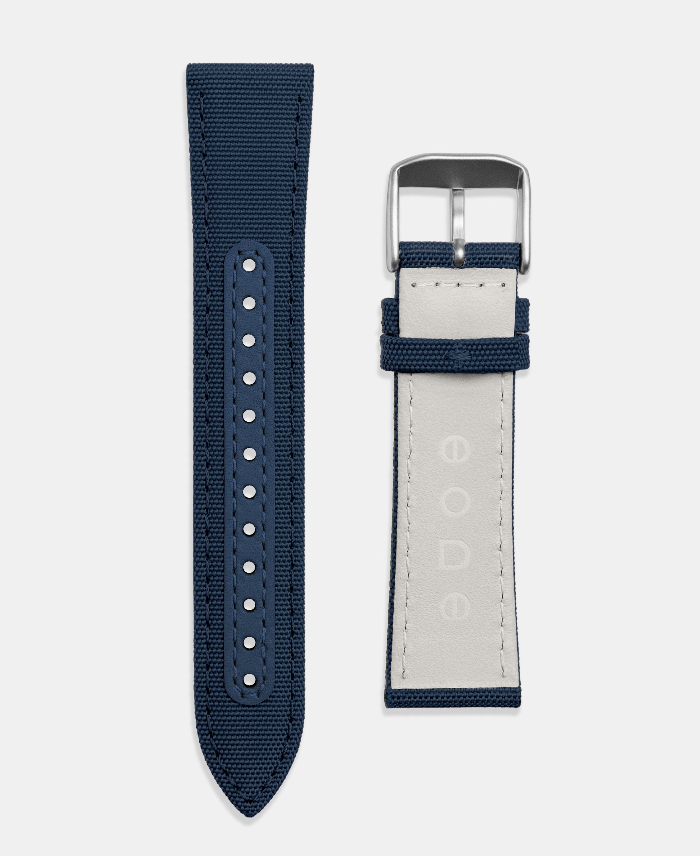 A photo shows the strap lying on a flat surface. One part has a buckle and the other part has a series of holes for an adjustable fit.
