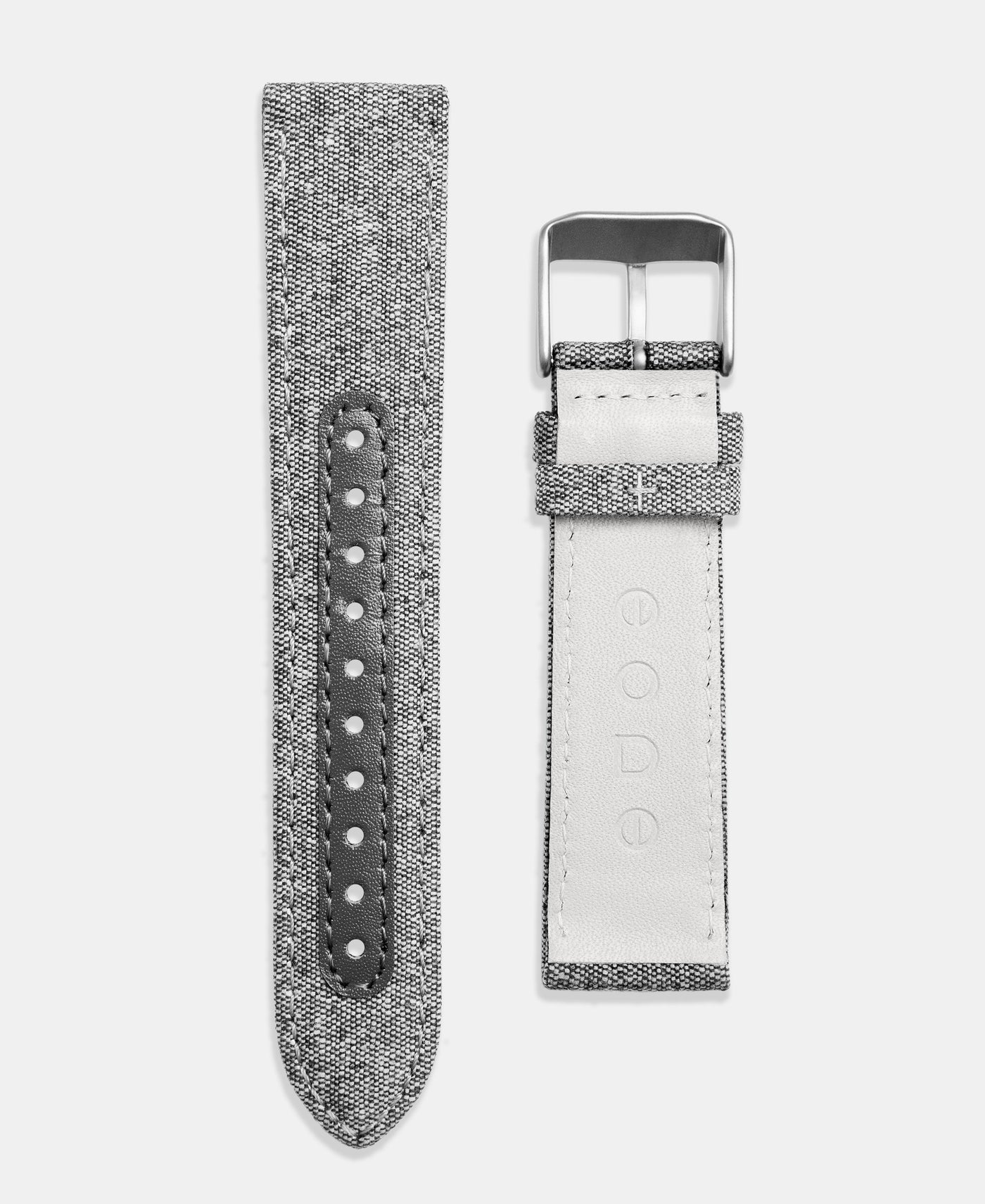 A photo shows the strap lying on a flat surface. One part has a buckle and the other part has a series of holes for an adjustable fit.