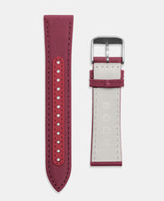 A photo shows the strap lying on a flat surface. One part has a buckle and the other part has a series of holes for an adjustable fit.