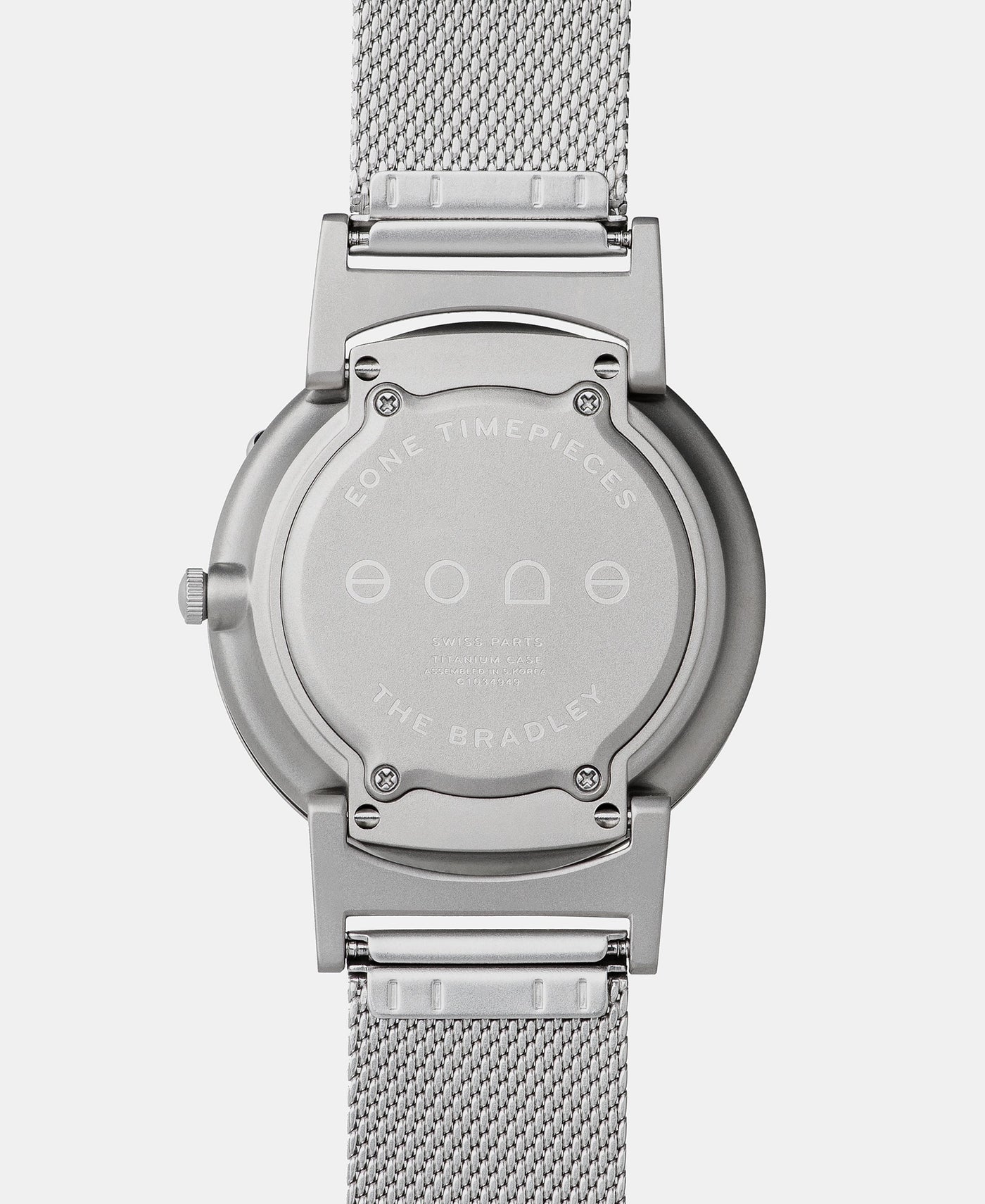A photo of the back of the watch, showing the back plate engraved with the Eone logo.