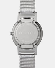 A photo of the back of the watch, showing the back plate engraved with the Eone logo.