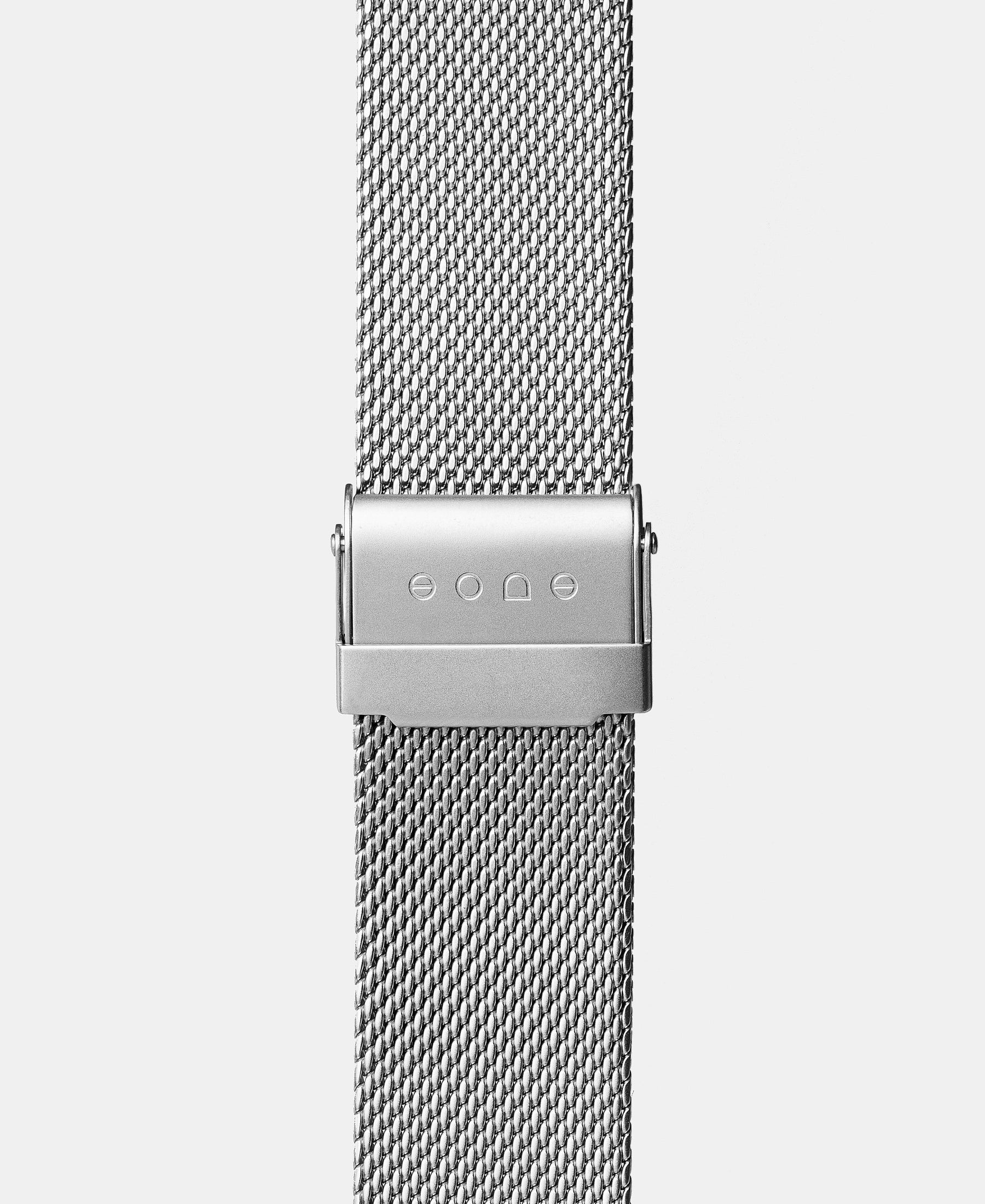 Load image into Gallery viewer, A photo shows the strap lying on a flat surface. One part has a fixed clasp and the other part has an adjustable clasp for a custom fit.