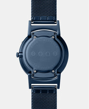 A photo of the back of the watch, showing the back plate engraved with the Eone logo.