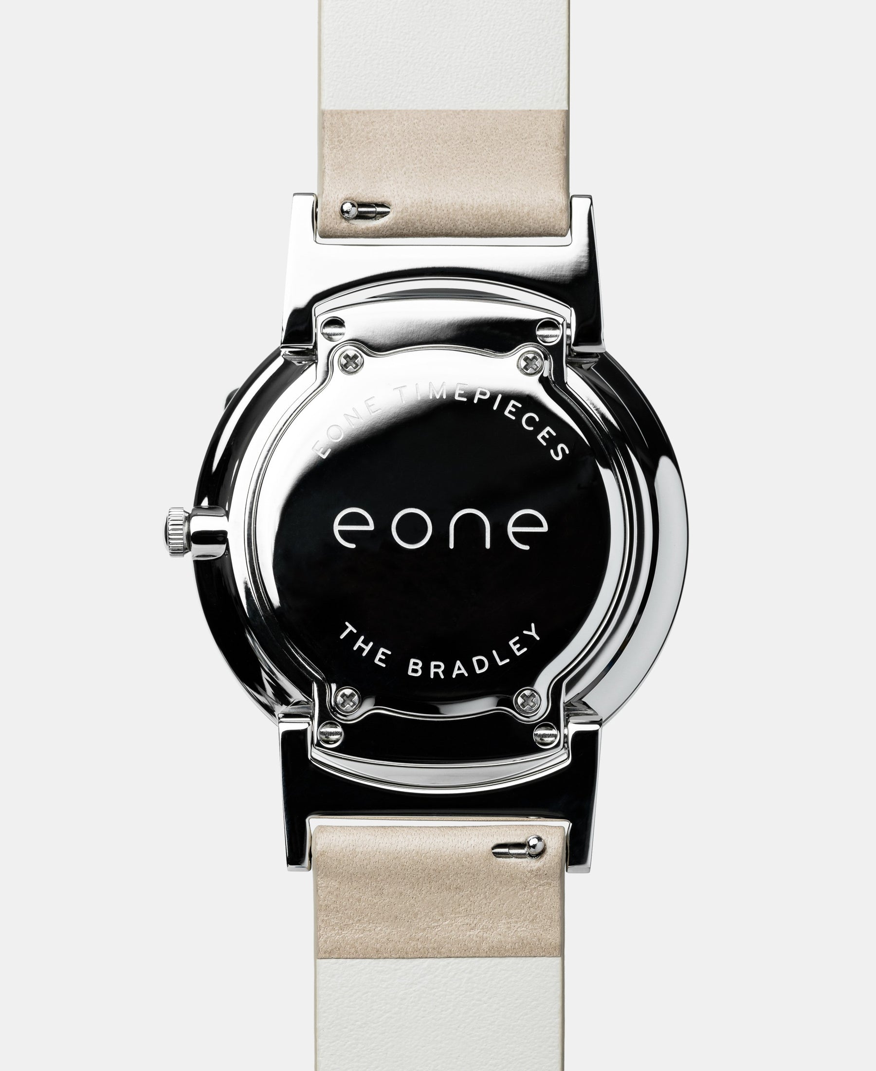 Load image into Gallery viewer, A photo of the back of the watch, showing the back plate engraved with the Eone logo.