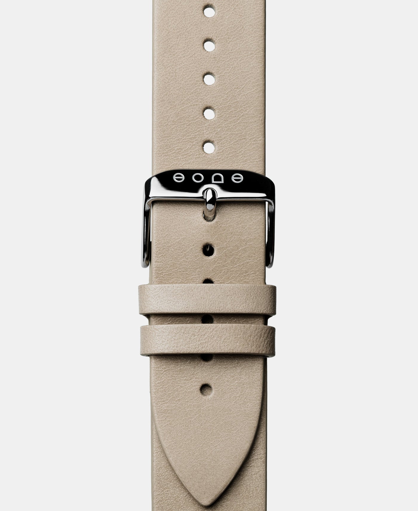 A photo shows the strap lying on a flat surface. One part has a buckle and the other part has a series of holes for an adjustable fit.