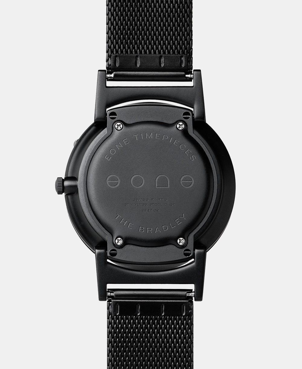 A photo of the back of the watch, showing the back plate engraved with the Eone logo.