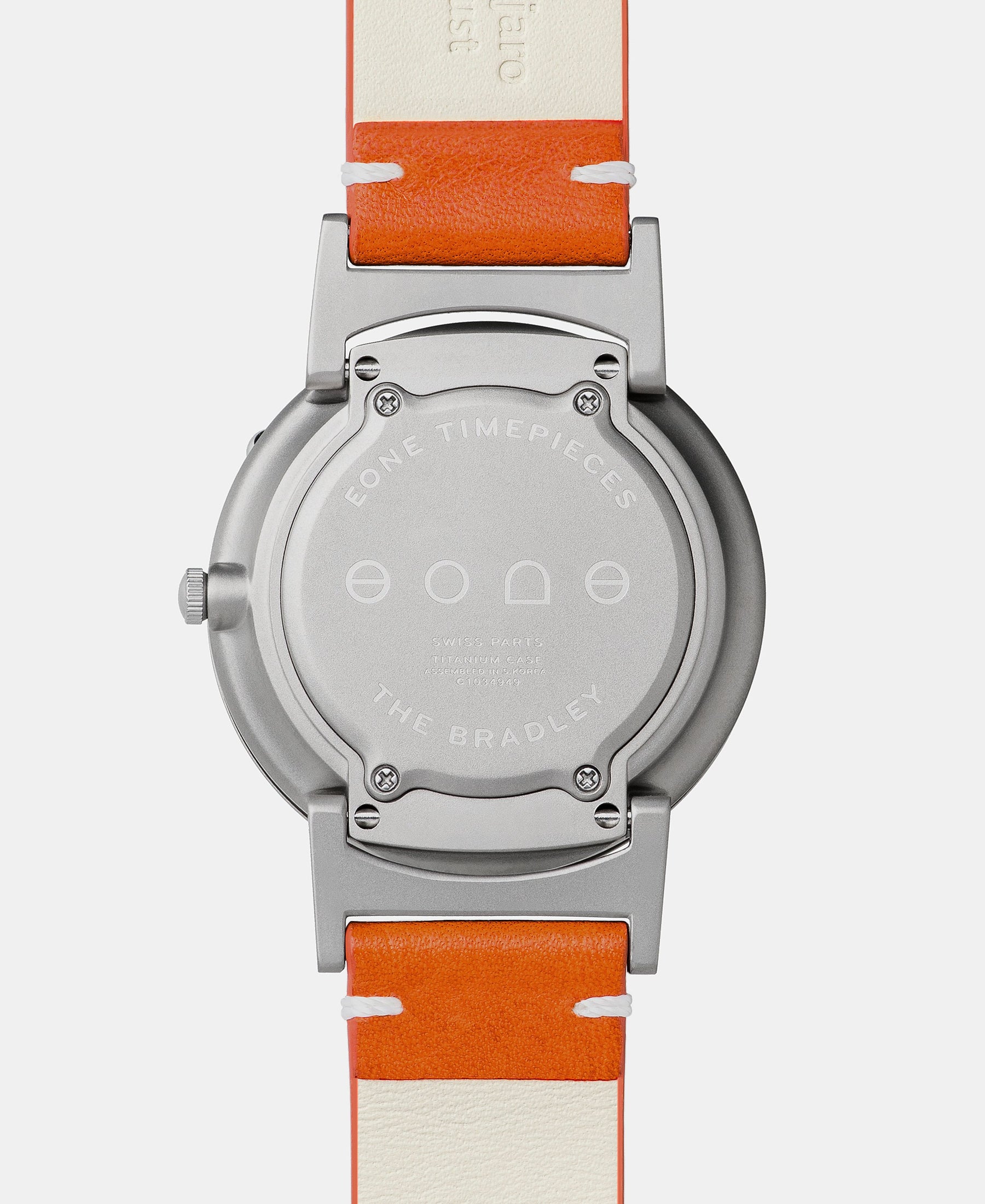 Load image into Gallery viewer, A photo of the back of the watch, showing the back plate engraved with the Eone logo.