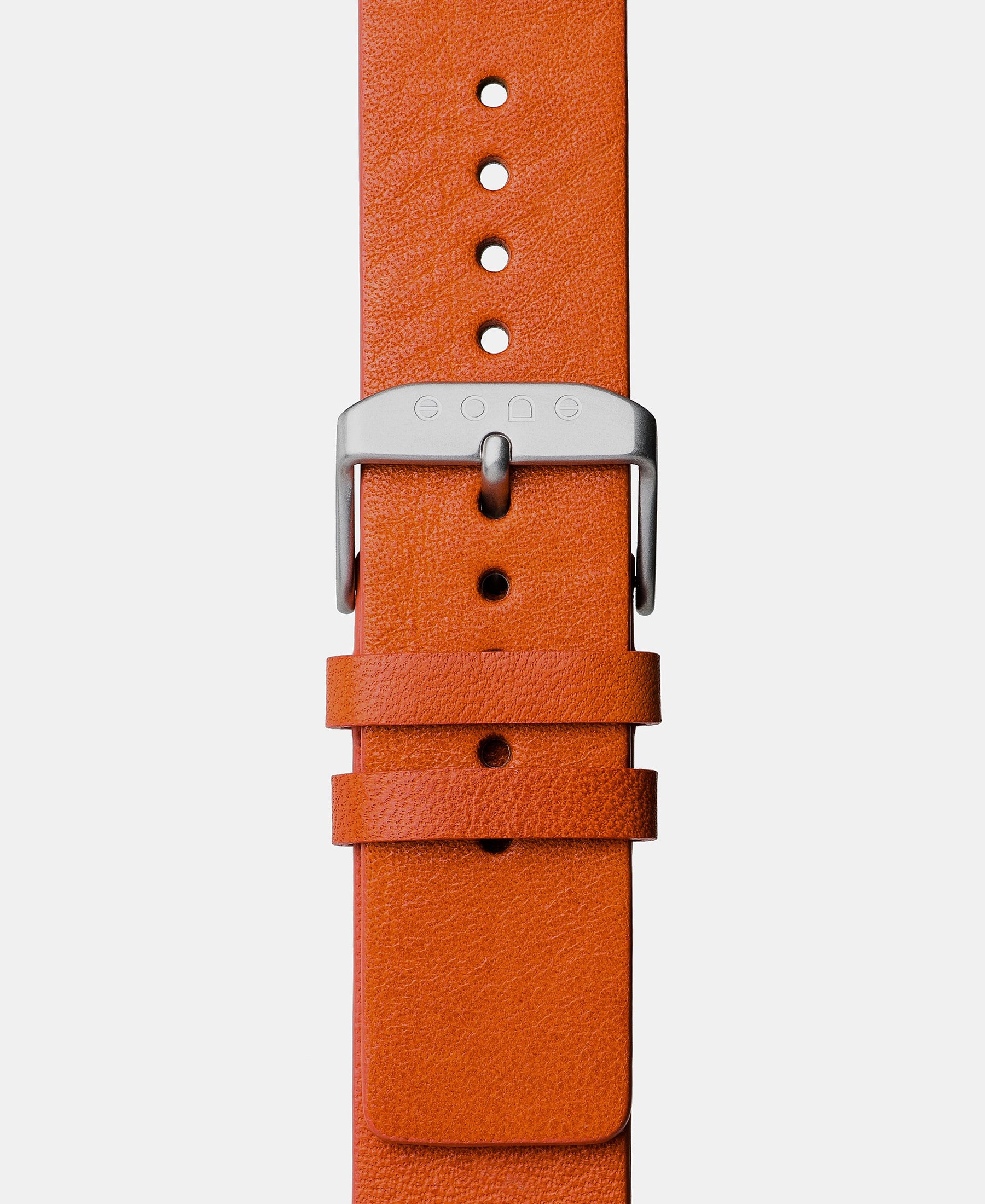 Load image into Gallery viewer, A photo shows the strap lying on a flat surface. One part has a buckle and the other part has a series of holes for an adjustable fit.