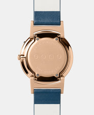 A photo of the back of the watch, showing the back plate engraved with the Eone logo.