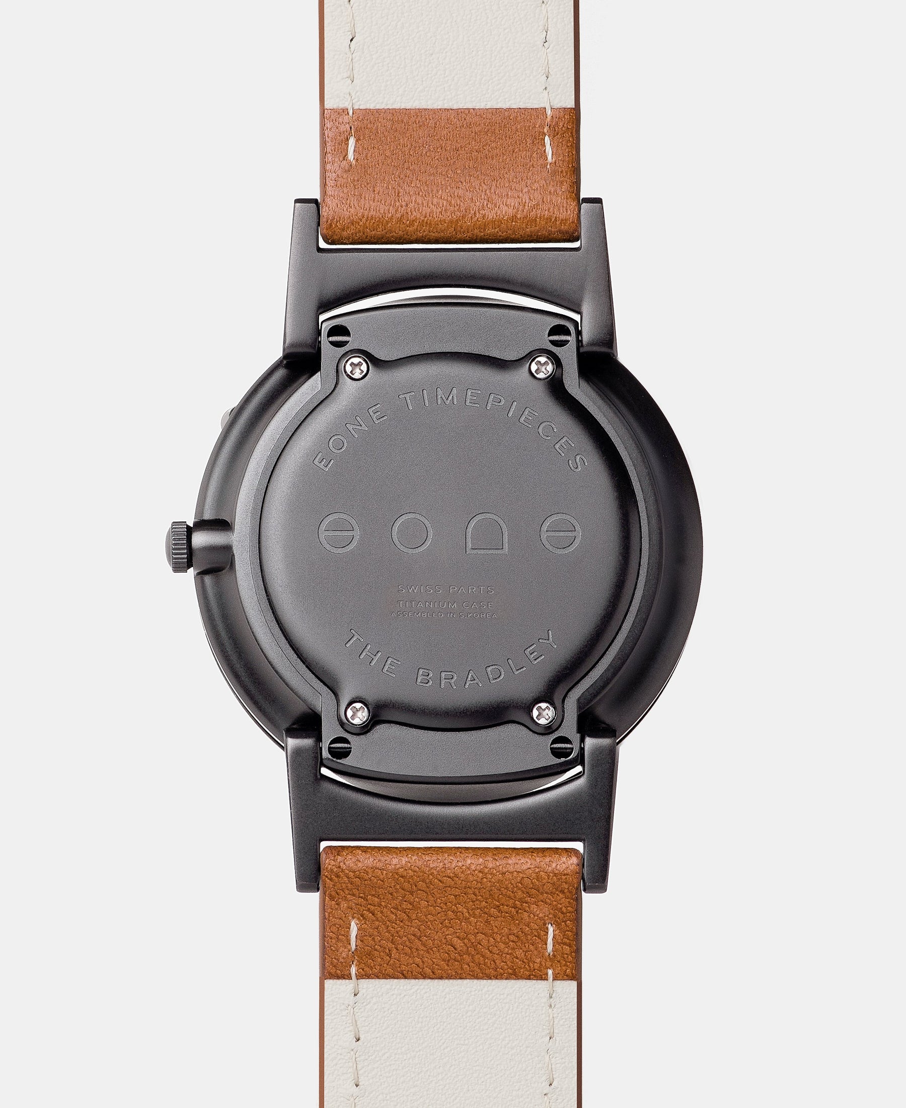 Load image into Gallery viewer, A photo of the back of the watch, showing the back plate engraved with the Eone logo.